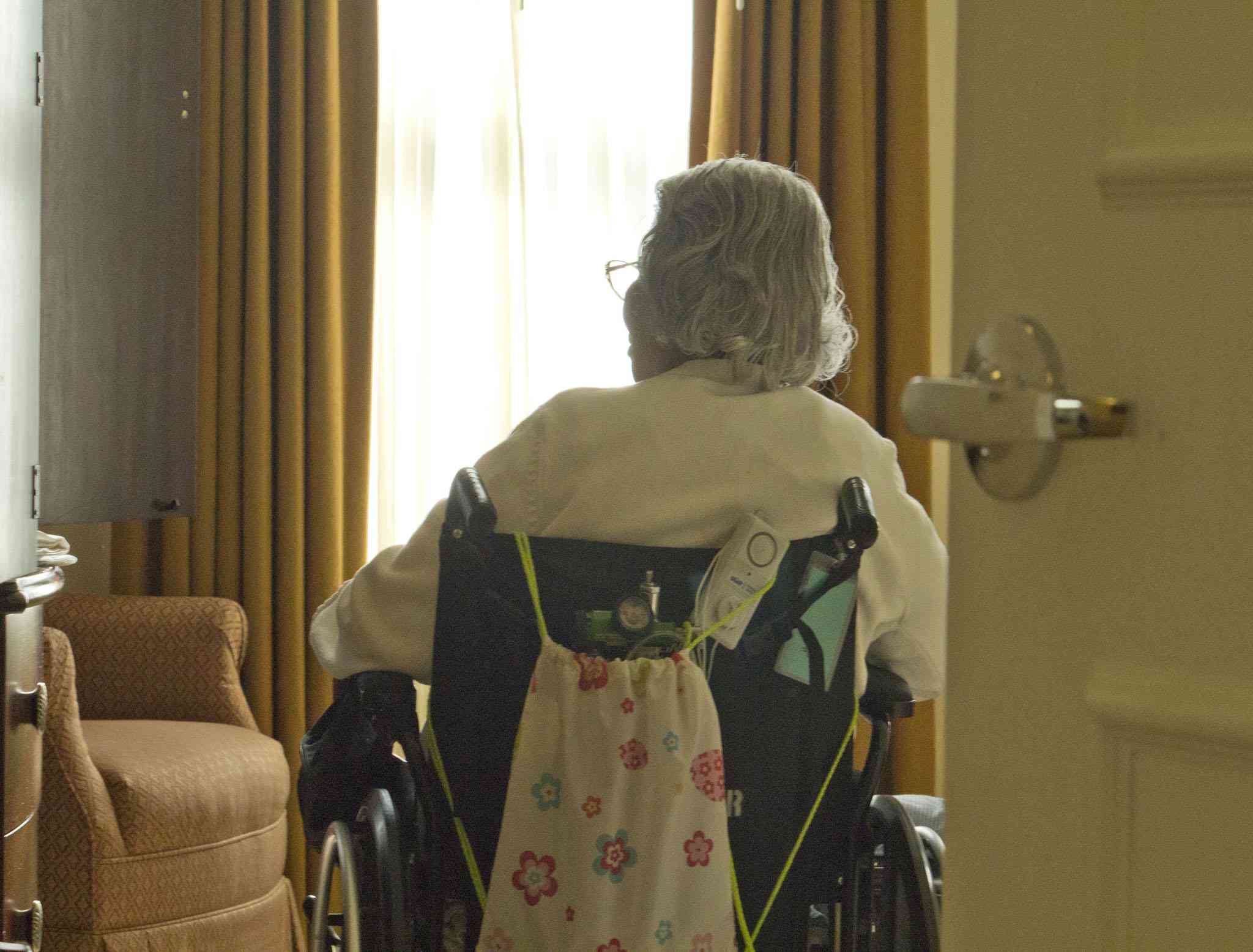 Elderly woman in her room