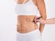 Doctor tracing the areas for liposuction