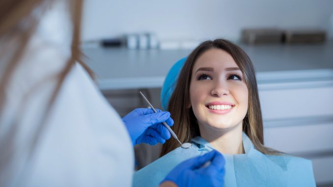 a cosmetic dentist at work