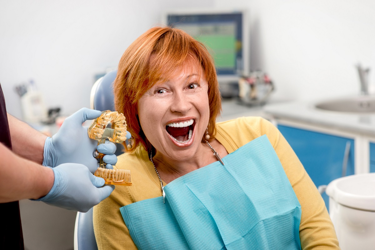 Woman smiling with new dental implants