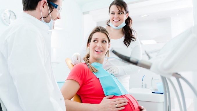 Pregnant woman in dentist