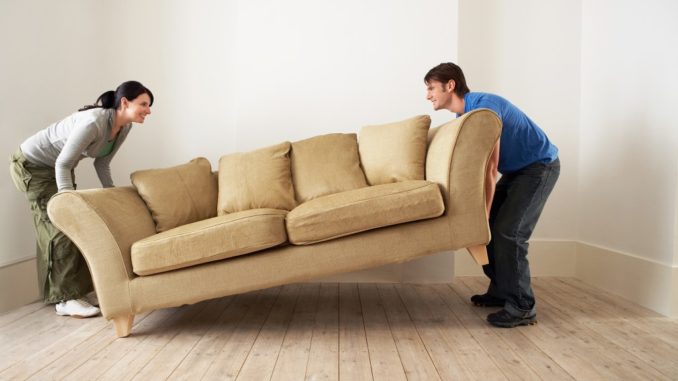 couple lifting couch