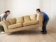 couple lifting couch