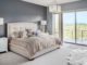 Luxury master bedroom with white carpet