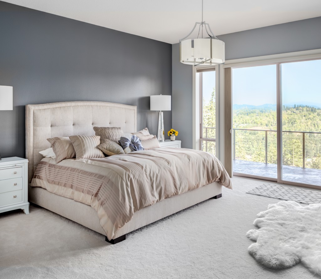Luxury master bedroom with white carpet