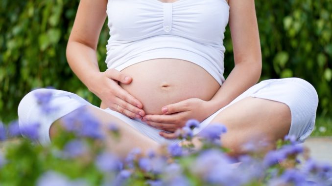 Pregnant woman outdoors