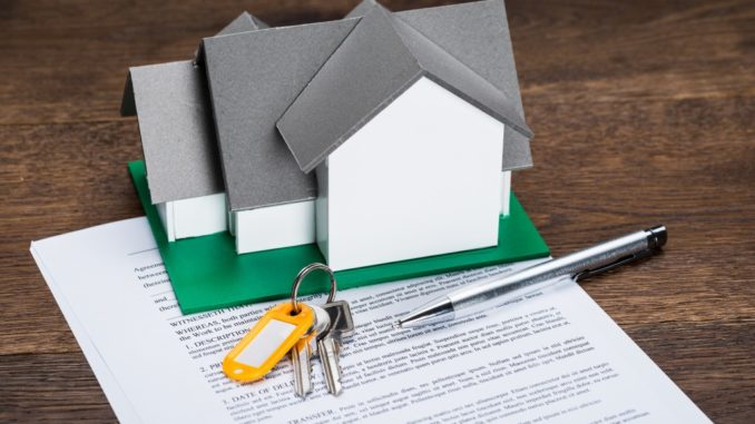 House Model With Keys And Ballpen On Contract Paper