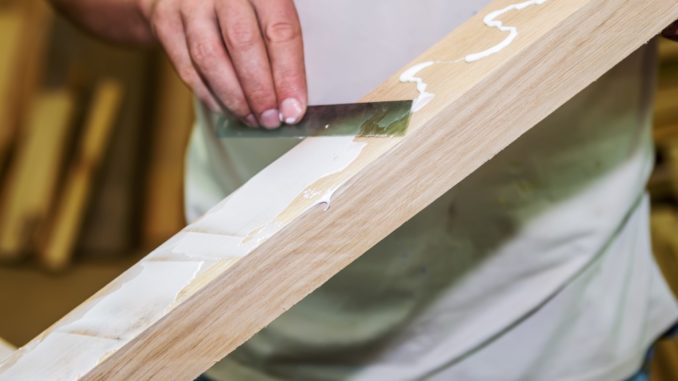 Man applying wood glue