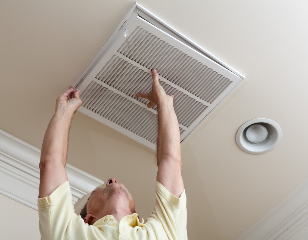 Man fixing open filter holder