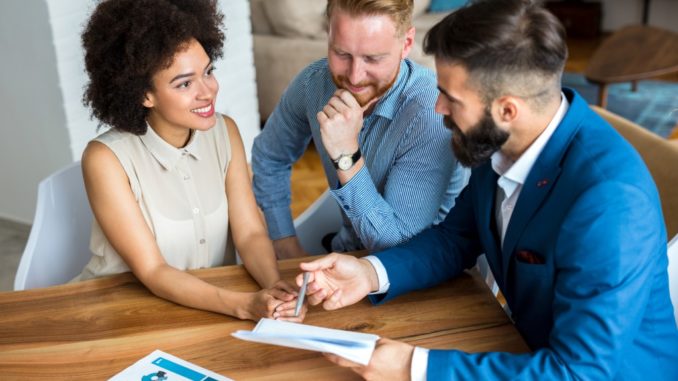 couple talking to a realtor