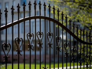 black iron fence of large building