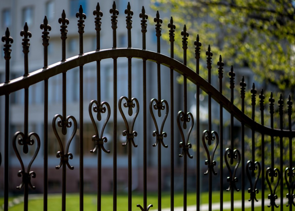 black iron fence of large building