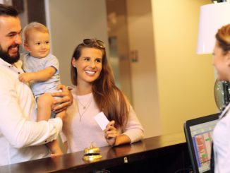 Picture of family checking in hotel