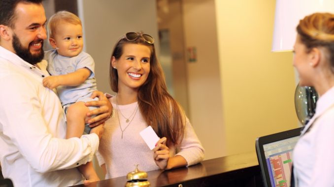 Picture of family checking in hotel