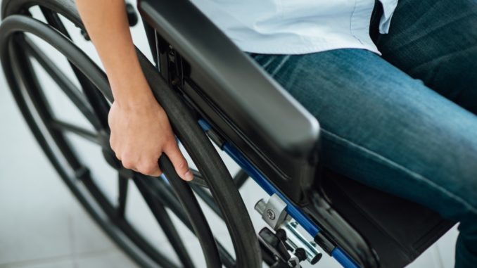 person with disability in a wheel chair