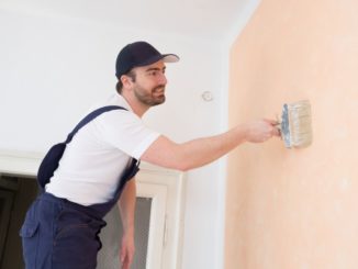 Man painting wall