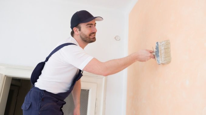 Man painting wall