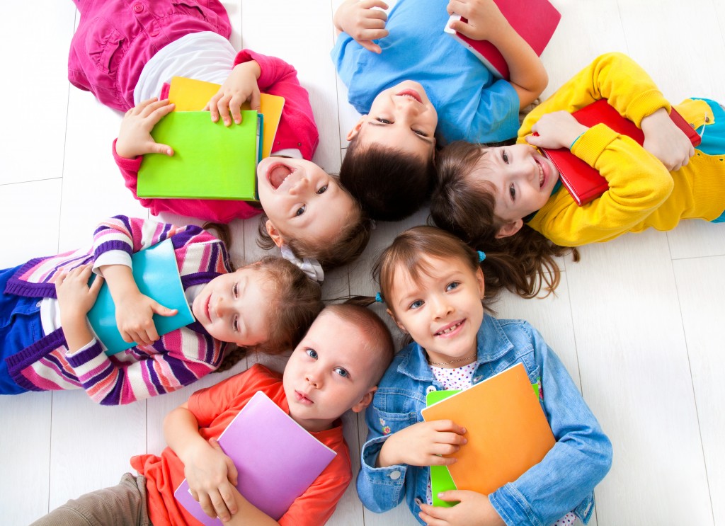 students holding a book