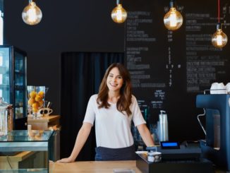 cafe owner behind the shop's counter