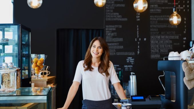 cafe owner behind the shop's counter