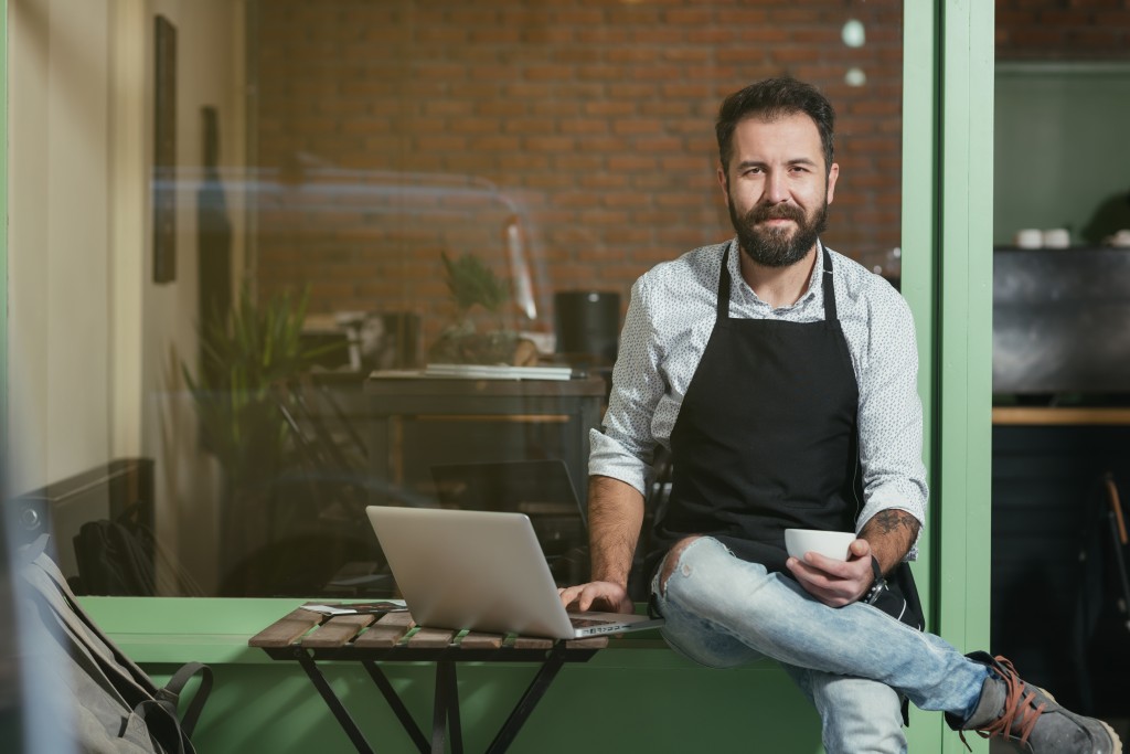 Business owner having coffee