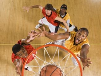 Men playing basketball