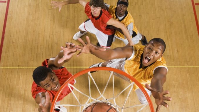 Men playing basketball