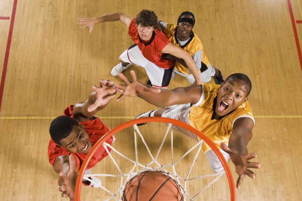 Men playing basketball