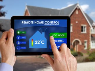 Holding a smart energy controller or remote home control online home automation system on a digital tablet