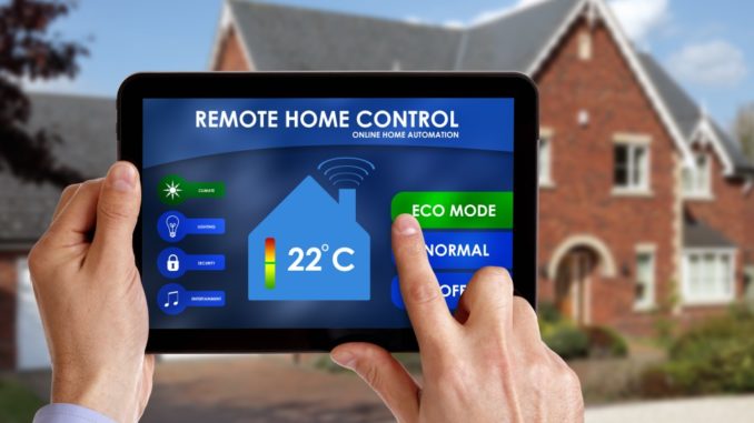 Holding a smart energy controller or remote home control online home automation system on a digital tablet