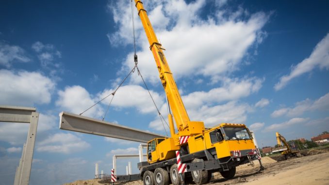Mobile crane lifitng steel beam