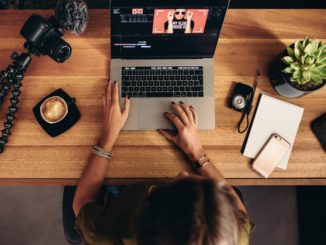 woman editing a video on the laptop