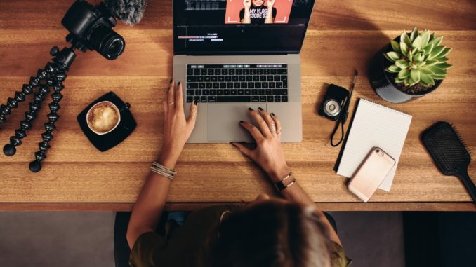 woman editing a video on the laptop