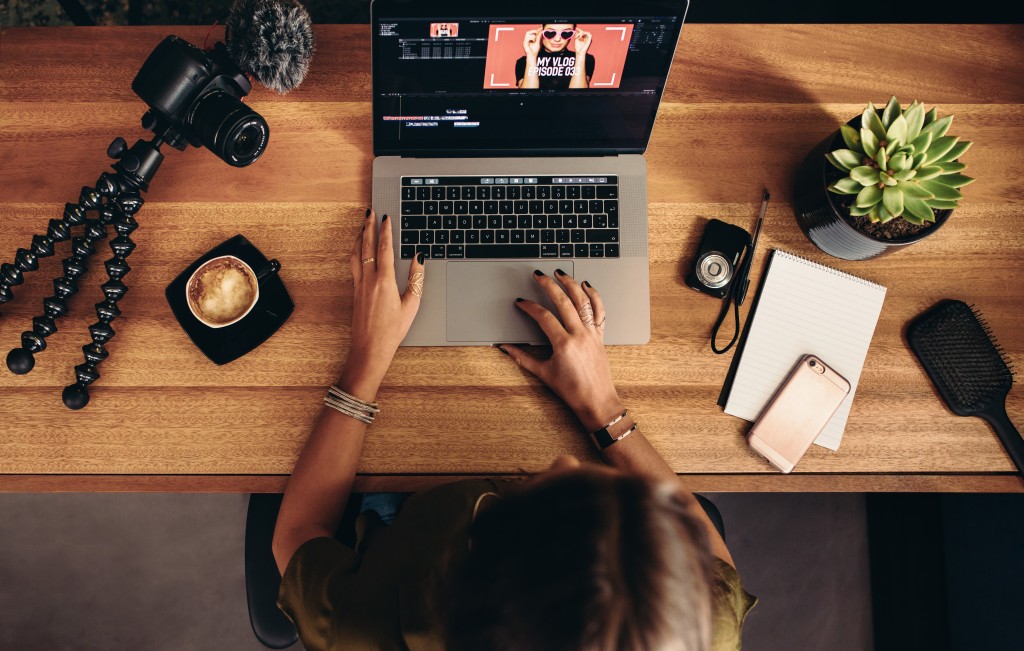 woman editing a video on the laptop