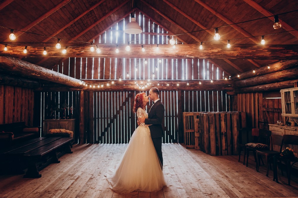 groom and bride in a barn wedding