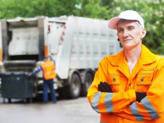 worker in yellow uniform working in waste management