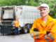 worker in yellow uniform working in waste management