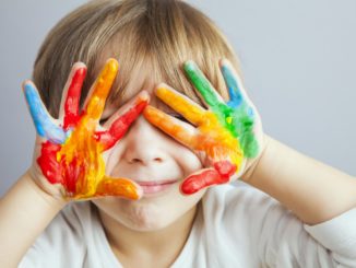 a child with fingerpaint