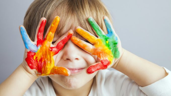 a child with fingerpaint