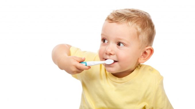 kid brushing teeth