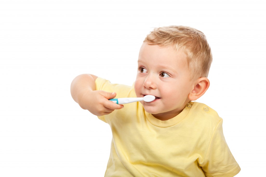 kid brushing teeth