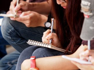 students taking notes in class