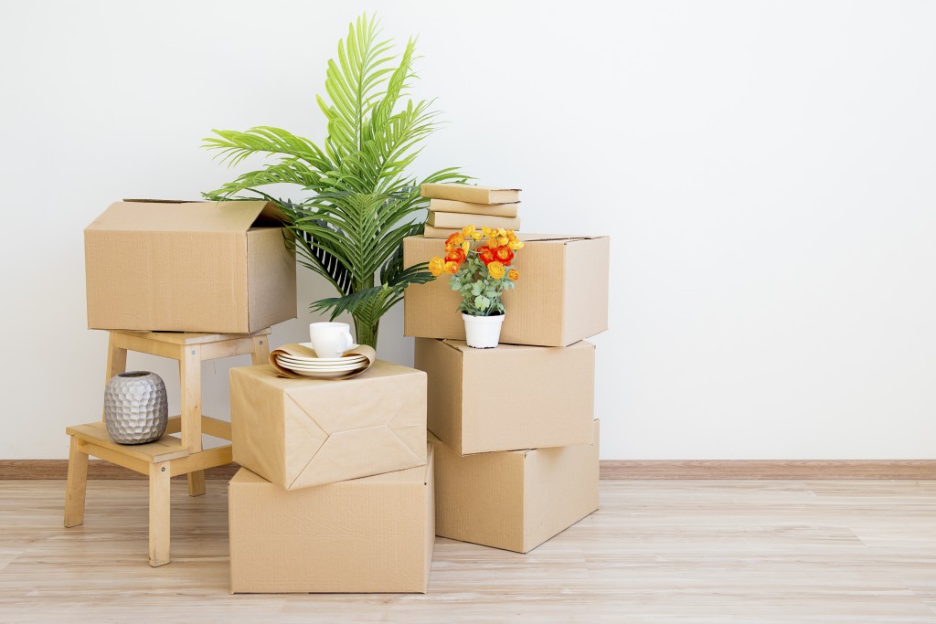 pile of boxes on the wooden floor