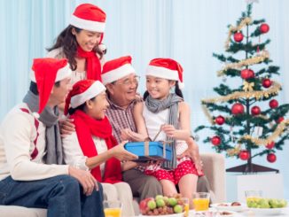 Family by the Christmas tree