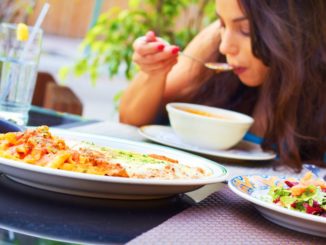 girl eating at restaurant