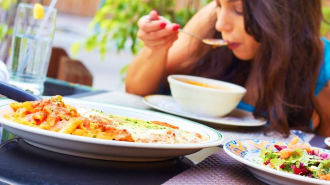 girl eating at restaurant