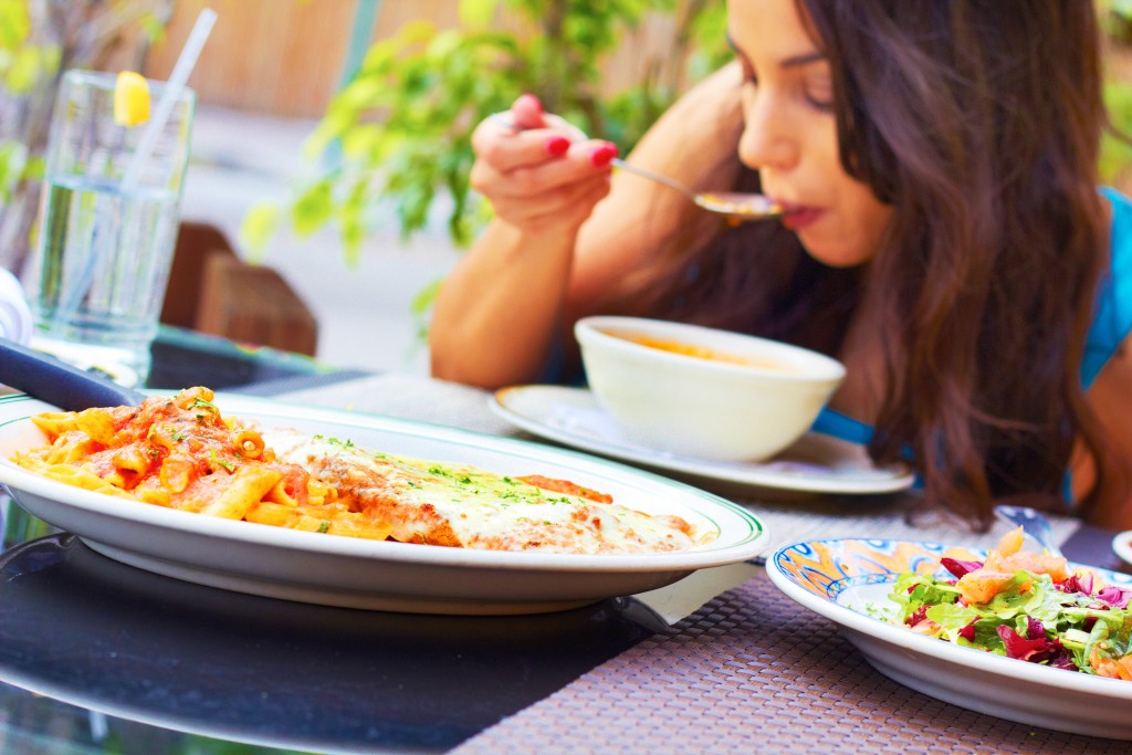 girl eating at restaurant