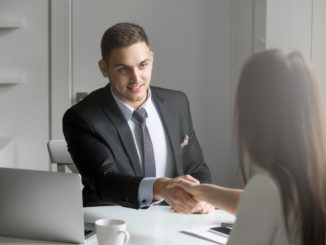 man shaking an applicant's hand