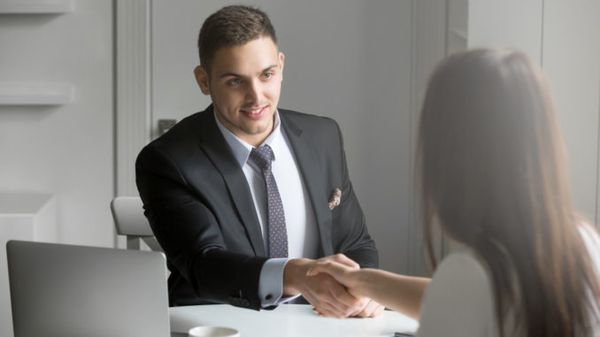 man shaking an applicant's hand