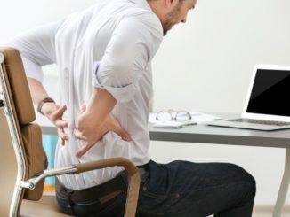 man suffering from back pain